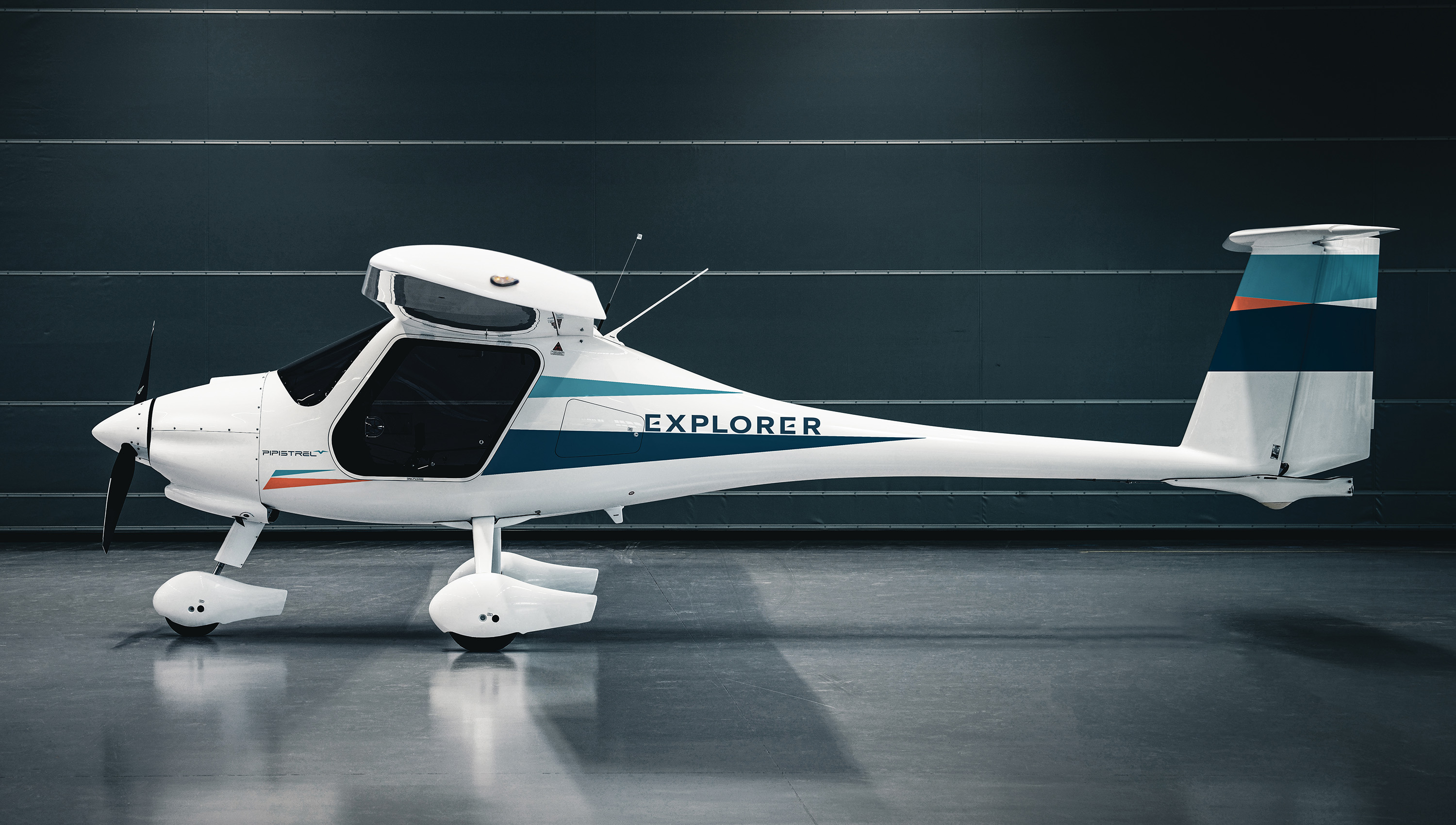 Pipistrel Explorer aircraft sits on the ground facing sideways
